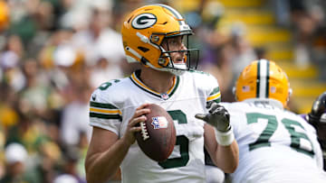 Aug 24, 2024; Green Bay, Wisconsin, USA;  Green Bay Packers quarterback Sean Clifford (6) looks to throw a pass during the second quarter against the Baltimore Ravens at Lambeau Field.