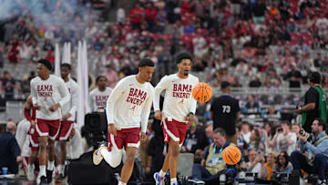 Apr 6, 2024; Glendale, AZ, USA; Alabama Crimson Tide runs onto the court to warmup before the semifinals of the men's Final Four of the 2024 NCAA Tournament against the Connecticut Huskies at State Farm Stadium. Mandatory Credit: Bob Donnan-Imagn Images