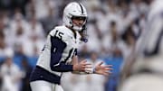 Dec 7, 2024; Indianapolis, IN, USA; Penn State Nittany Lions quarterback Drew Allar (15) looks downfield against the Oregon Ducks against the Oregon Ducks in the 2024 Big Ten Championship game at Lucas Oil Stadium. Mandatory Credit: Jordan Prather-Imagn Images