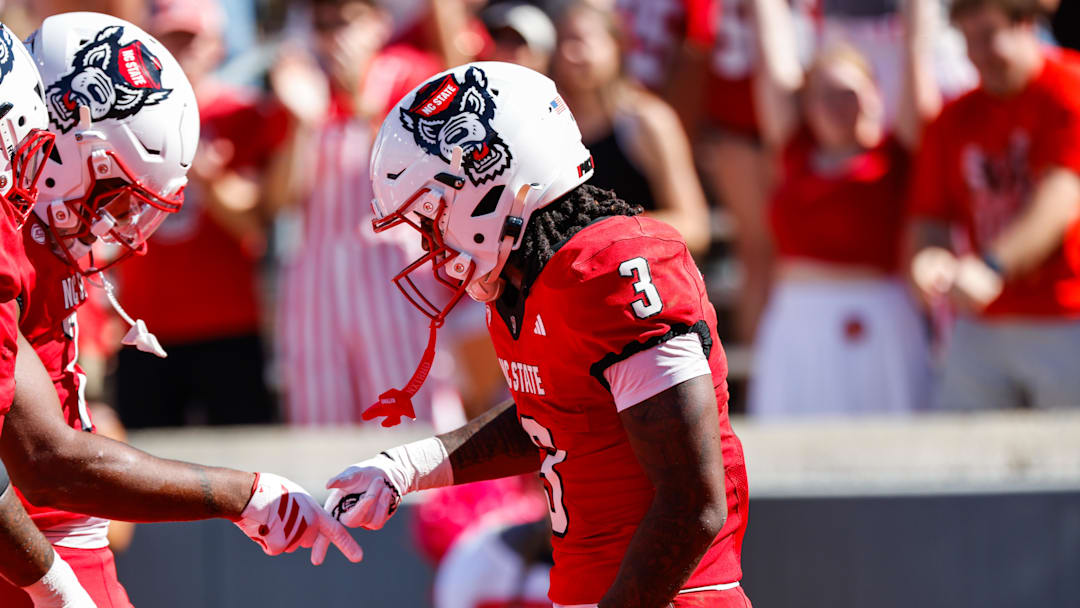 Oct 4, 2025; Raleigh, North Carolina, USA;  NC State Wolfpack running back Hollywood Smothers (3) celebrates a touchdown with teammates during the first half of the game against Campbell Fighting Camels at Carter-Finley Stadium. Mandatory Credit: Jaylynn Nash-Imagn Images