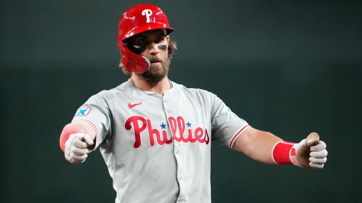 Aug 8, 2024; Phoenix, Arizona, USA; Philadelphia Phillies first base Bryce Harper (3) reacts after hitting an RBI single against the Arizona Diamondbacks during the sixth inning at Chase Field.