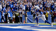 Sep 8, 2024; Indianapolis, Indiana, USA; Indianapolis Colts running back Jonathan Taylor (28) celebrates as he runs in for a touchdown Sunday, Sept. 8, 2024, during a game against the Houston Texans at Lucas Oil Stadium. Mandatory Credit: Grace Hollars/USA TODAY Network via Imagn Images