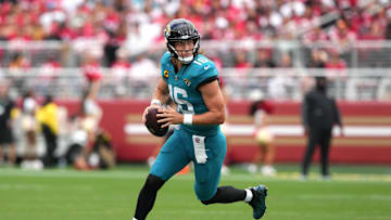 Sep 28, 2025; Santa Clara, California, USA; Jacksonville Jaguars quarterback Trevor Lawrence (16) scrambles against the San Francisco 49ers during the second quarter at Levi's Stadium. Mandatory Credit: Darren Yamashita-Imagn Images
