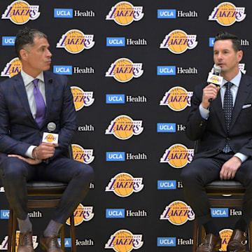 Jun 24, 2024; El Segundo, CA, USA; Los Angeles Lakers general manager Rob Pelinka loosk on as head coach JJ Redick speaks to the media during an introductory news conference at the UCLA Health Training Center. Mandatory Credit: Jayne Kamin-Oncea-Imagn Images