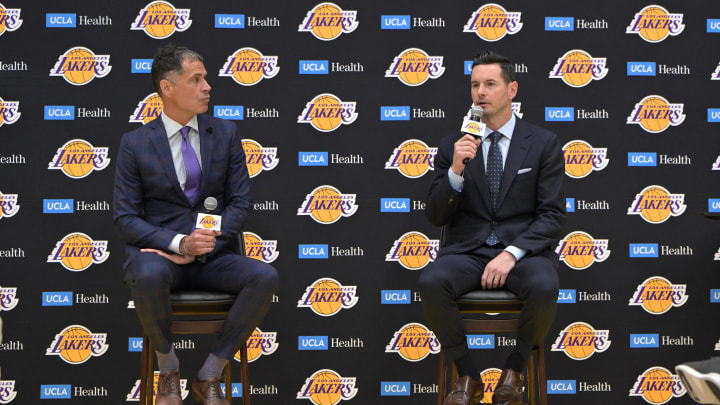 Jun 24, 2024; El Segundo, CA, USA; Los Angeles Lakers general manager Rob Pelinka loosk on as head coach JJ Redick speaks to the media during an introductory news conference at the UCLA Health Training Center. Mandatory Credit: Jayne Kamin-Oncea-USA TODAY Sports