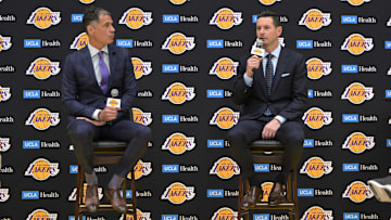Jun 24, 2024; El Segundo, CA, USA; Los Angeles Lakers general manager Rob Pelinka loosk on as head coach JJ Redick speaks to the media during an introductory news conference at the UCLA Health Training Center. Mandatory Credit: Jayne Kamin-Oncea-USA TODAY Sports