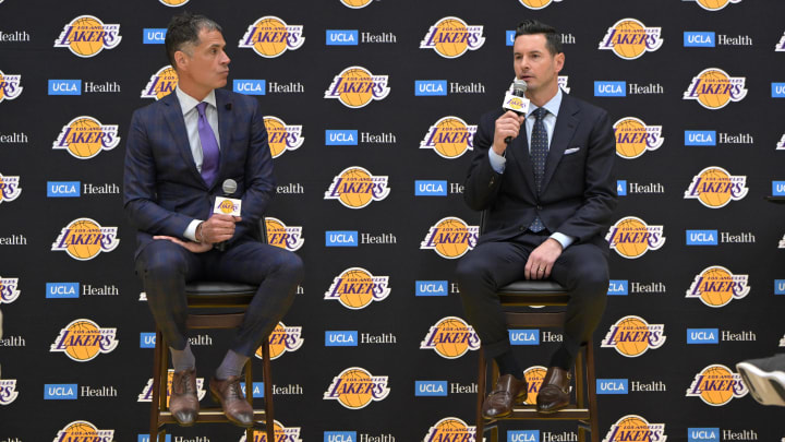 Jun 24, 2024; El Segundo, CA, USA; Los Angeles Lakers general manager Rob Pelinka loosk on as head coach JJ Redick speaks to the media during an introductory news conference at the UCLA Health Training Center. Mandatory Credit: Jayne Kamin-Oncea-USA TODAY Sports