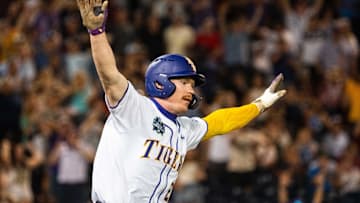 Jun 18, 2025; Omaha, Neb, USA; LSU Tigers first baseman Jared Jones (22) celebrates after hitting a walk off RBI single against the Arkansas Razorbacks during the ninth inning at Charles Schwab Field. 