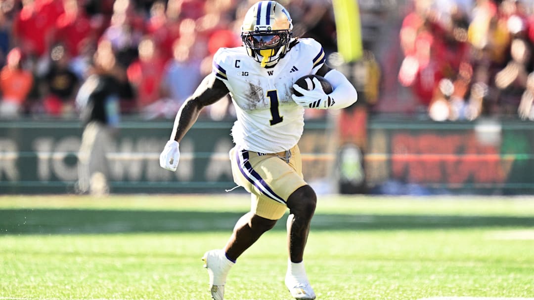 Oct 4, 2025; College Park, Maryland, USA;  Washington Huskies running back Jonah Coleman (1) carries the ball against the Maryland Terrapins at SECU Stadium. Mandatory Credit: Jamie Sabau-Imagn Images
