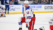 Mar 2, 2024; Toronto, Ontario, CAN;  New York Rangers forward Alexis Lafreniere (13) warms up before playing the Toronto Maple Leafs at Scotiabank Arena. Mandatory Credit: Dan Hamilton-Imagn Images