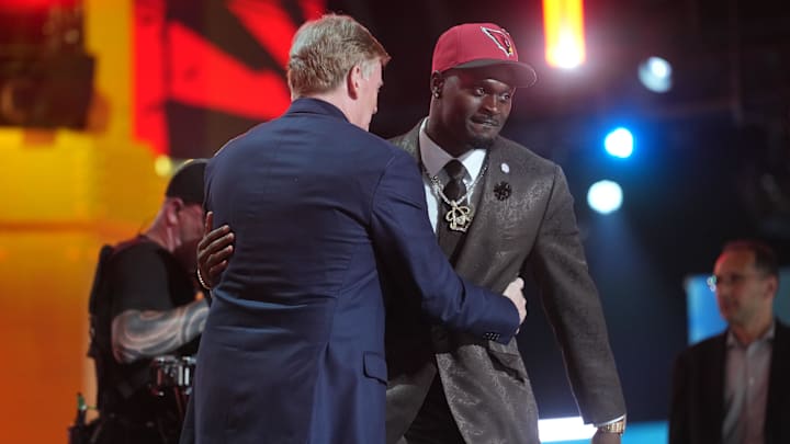 Apr 23, 2026; Pittsburgh, PA, USA; Notre Dame Fighting Irish running back Jeremiyah Love embraces NFL commissioner Roger Goodell after he is selected by the Arizona Cardinals as the number three pick during the 2026 NFL Draft at Acrisure Stadium. Mandatory Credit: Kirby Lee-Imagn Images