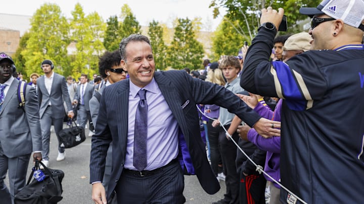 Oct 5, 2024; Seattle, Washington, USA; Washington Huskies head coach Jedd Fisch walks into Alaska Airlines Field at Husky Stadium before a game against the Michigan Wolverines. Mandatory Credit: Joe Nicholson-Imagn Images