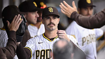Sep 18, 2024; San Diego, California, USA; San Diego Padres starting pitcher Dylan Cease (84) is congratulated in the dugout after a pitching change in the ninth inning against the Houston Astros at Petco Park. Mandatory Credit: Orlando Ramirez-Imagn Images