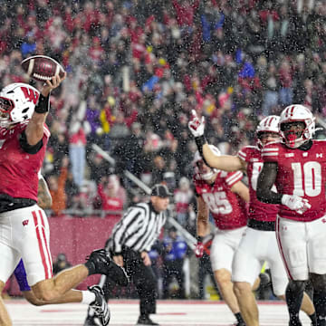Nov 8, 2025; Madison, Wisconsin, USA;  Wisconsin Badgers quarterback Carter Smith (5) celebrates after rushing for a touchdown during the third quarter against the Washington Huskies at Camp Randall Stadium. Mandatory Credit: Jeff Hanisch-Imagn Images