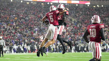 Nov 8, 2025; Madison, Wisconsin, USA;  Wisconsin Badgers quarterback Carter Smith (5) celebrates after scoring a touchdown during the third quarter against the Washington Huskies at Camp Randall Stadium. Mandatory Credit: Jeff Hanisch-Imagn Images