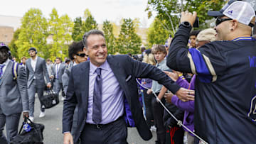 Oct 5, 2024; Seattle, Washington, USA; Washington Huskies head coach Jedd Fisch walks into Alaska Airlines Field at Husky Stadium before a game against the Michigan Wolverines. Mandatory Credit: Joe Nicholson-Imagn Images