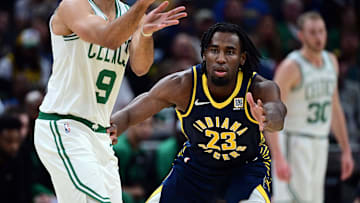 Oct 30, 2024; Indianapolis, Indiana, USA; Indiana Pacers forward Aaron Nesmith (23) defends against Boston Celtics guard Derrick White (9) during the second quarter at Gainbridge Fieldhouse. Mandatory Credit: Marc Lebryk-Imagn Images