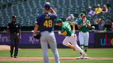 Aug 24, 2024; Oakland, California, USA; Oakland Athletics outfielder JJ Bleday (33) runs the bases after hitting a one run home run against Milwaukee Brewers starting pitcher Colin Rea (48) during the first inning at Oakland-Alameda County Coliseum. Mandatory Credit: Robert Edwards-Imagn Images