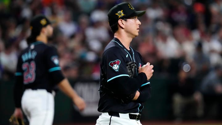 Diamondbacks pitcher Matt Bowman (55) reacts to allowing a two-run double against the Tigers during a game at Chase Field on Friday, May 17, 2024.