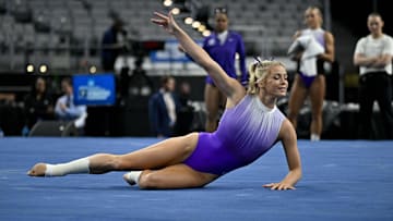 Apr 20, 2024; Fort Worth, TX, USA; LSU Tigers gymnast Olivia Dunne warms up on floor before the start of the 2024 Womens National Gymnastics Championship at Dickies Arena. Mandatory Credit: Jerome Miron-Imagn Images