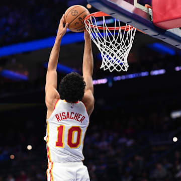 Apr 11, 2025; Philadelphia, Pennsylvania, USA; Atlanta Hawks forward Zaccharie Risacher (10) dunks against the Philadelphia 76ers in the second quarter at Wells Fargo Center. Mandatory Credit: Kyle Ross-Imagn Images