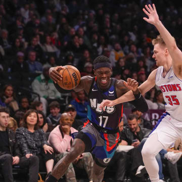 Apr 6, 2024; Brooklyn, New York, USA; Brooklyn Nets point guard Dennis Schroder (17) drives the ball against Detroit Pistons guard Buddy Boeheim (35) during the second half at Barclays Center. Mandatory Credit: Gregory Fisher-USA TODAY Sports