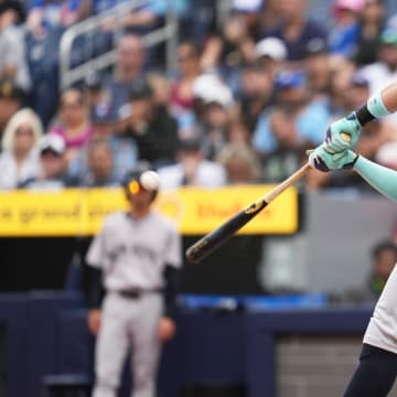 New York Yankees designated hitter Aaron Judge (99) hits a two run home run against the Toronto Blue Jays during the first inning at Rogers Centre. 