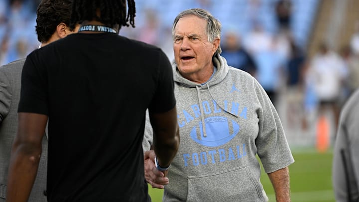 North Carolina Tar Heels head coach Bill Belichick with a recruit before the game at Kenan Stadium. North Carolina Tar Heels head coach Bill Belichick with a recruit before the game at Kenan Stadium.