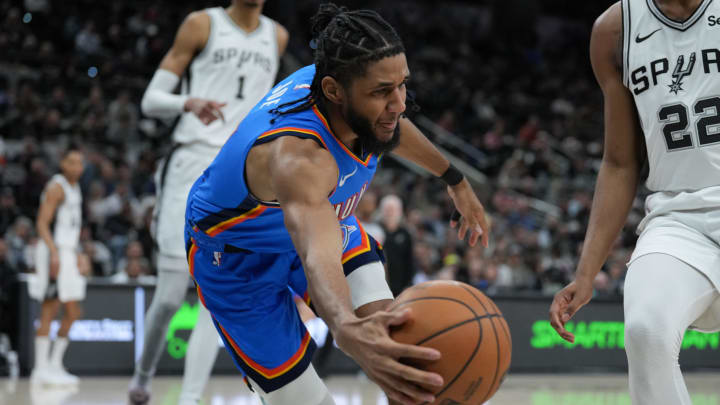 Feb 29, 2024; San Antonio, Texas, USA;  Oklahoma City Thunder guard Isaiah Joe (11) reaches for a ball in the second half against the Oklahoma City Thunder at Frost Bank Center. Mandatory Credit: Daniel Dunn-USA TODAY Sports