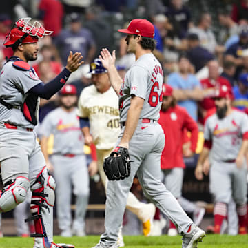 Sep 4, 2024; Milwaukee, Wisconsin, USA;  St. Louis Cardinals pitcher Ryan Fernandez (64) greets catcher Ivan Herrera (48) following the game against the Milwaukee Brewers at American Family Field. Mandatory Credit: Jeff Hanisch-Imagn Images