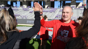 Texas Tech's head football coach Joey McGuire high-fives cheerleaders before the game against TCU, Saturday, Nov. 5, 2022, at Amon G. Carter Stadium in Fort Worth.