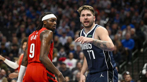 Jan 3, 2024; Dallas, Texas, USA; Dallas Mavericks guard Luka Doncic (77) argues a call as Portland Trail Blazers forward Jerami Grant (9) looks on during the second half at the American Airlines Center. Mandatory Credit: Jerome Miron-USA TODAY Sports
