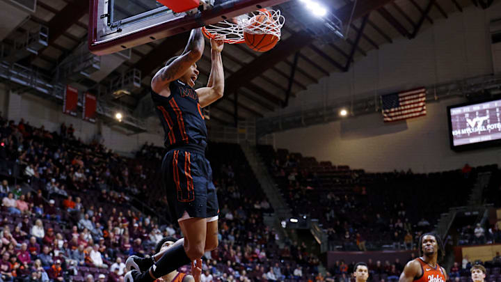 Jan 4, 2025; Blacksburg, Virginia, USA; Miami Hurricanes guard Matthew Cleveland (0) dunks the ball during the second half against the Virginia Tech Hokies at Cassell Coliseum. Mandatory Credit: Peter Casey-Imagn Images