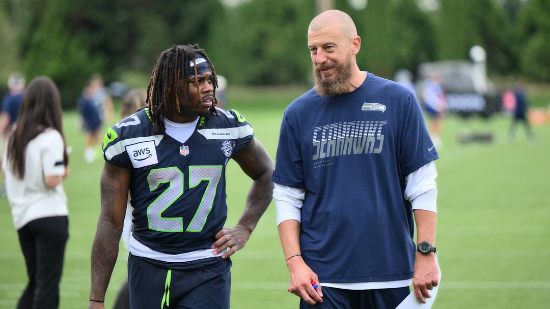 Jul 25, 2026; Renton, WA, USA; Seattle Seahawks running back Emanuel Wilson (27) and offensive coordinator Brian Fleury after the first training camp at Virginia Mason Athletic Center.