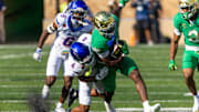 Notre Dame's Jeremiyah Love is tackled by Boise State defensive back Davon Banks.