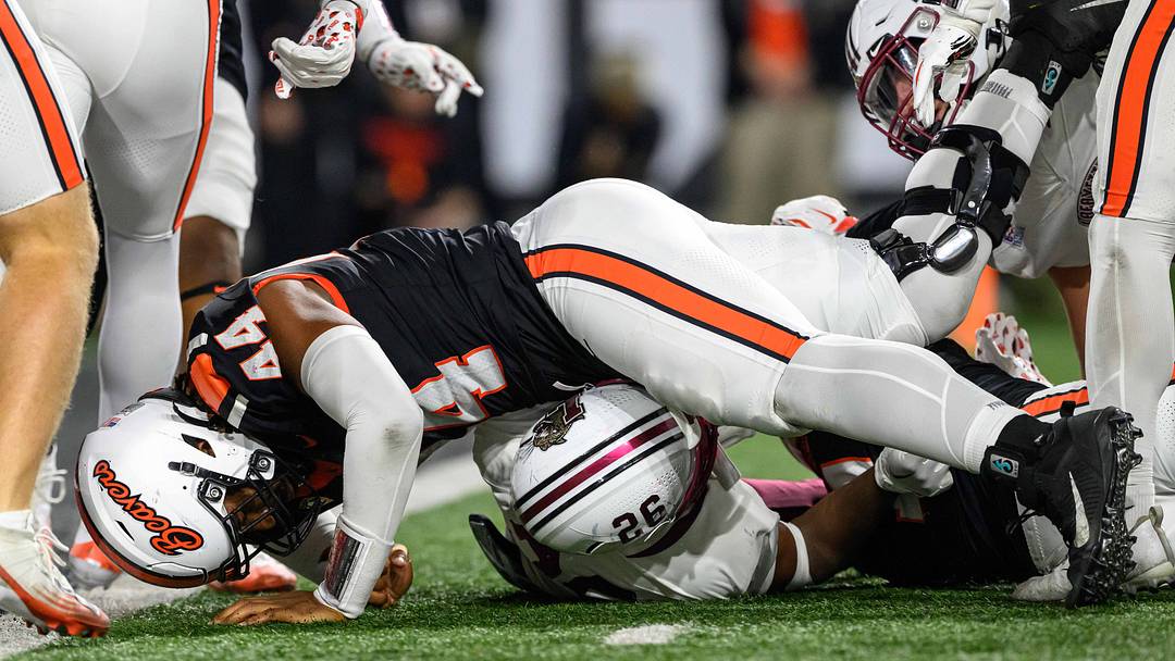 Oct 18, 2025; Corvallis, Oregon, USA; Lafayette Leopards running back Kente Edwards (26) is stopped behind the line by Oregon State Beavers defensive lineman Takari Hickle (44) during the second quarter at Reser Stadium. Mandatory Credit: Craig Strobeck-Imagn Images Oct 18, 2025; Corvallis, Oregon, USA; Lafayette Leopards running back Kente Edwards (26) is stopped behind the line by Oregon State Beavers defensive lineman Takari Hickle (44) during the second quarter at Reser Stadium. Mandatory Credit: Craig Strobeck-Imagn Images