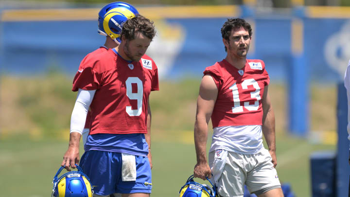 May 28, 2024; Thousand Oaks, CA, USA; Los Angeles Rams quarterbacks Matthew Stafford (9) and Stetson Bennett (13) during OTAs at the team training facility at California Lutheran University. Mandatory Credit: Jayne Kamin-Oncea-USA TODAY Sports