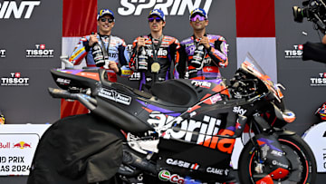 Apr 13, 2024; Austin, TX, USA; (from left) Marc Marquez (93) of Spain and Gresini Racing MotoGP and Maverick Vinales (12) of Spain and Aprilia Racing and Jorge Martin (89) of Spain and Prima Pramac Racing pose for a photo on the podium after the Americas Grand Prix sprint race at Circuit of The Americas. Mandatory Credit: Jerome Miron-Imagn Images