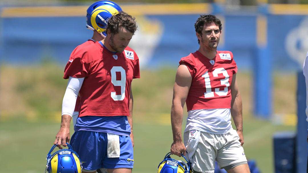May 28, 2024; Thousand Oaks, CA, USA; Los Angeles Rams quarterbacks Matthew Stafford (9) and Stetson Bennett (13) during OTAs at the team training facility at California Lutheran University. Mandatory Credit: Jayne Kamin-Oncea-USA TODAY Sports