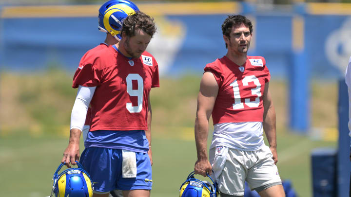 May 28, 2024; Thousand Oaks, CA, USA; Los Angeles Rams quarterbacks Matthew Stafford (9) and Stetson Bennett (13) during OTAs at the team training facility at California Lutheran University. Mandatory Credit: Jayne Kamin-Oncea-USA TODAY Sports