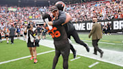 Sep 21, 2025; Cleveland, Ohio, USA; Cleveland Browns center Luke Wypler (56) hugs assistant head coach/special teams coach Bubba Ventrone after the Browns beat the Green Bay Packers at Huntington Bank Field. Mandatory Credit: Ken Blaze-Imagn Images