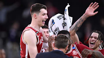 Mar 22, 2025; Providence, RI, USA; Arkansas Razorbacks forward Zvonimir Ivisic (44) and teammates celebrate after defeating the St. John's Red Storms in a second round men’s NCAA Tournament game at Amica Mutual Pavilion. Mandatory Credit: Brian Fluharty-Imagn Images
