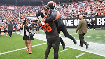Sep 21, 2025; Cleveland, Ohio, USA; Cleveland Browns center Luke Wypler (56) hugs assistant head coach/special teams coach Bubba Ventrone after the Browns beat the Green Bay Packers at Huntington Bank Field. Mandatory Credit: Ken Blaze-Imagn Images