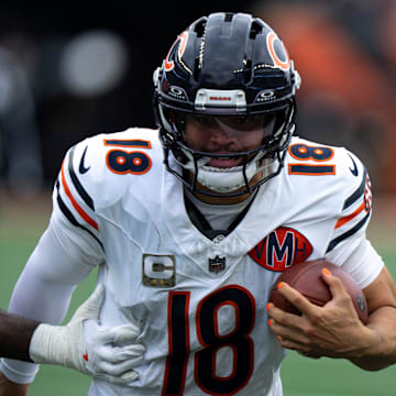 Chicago Bears quarterback Caleb Williams (18) runs by Cincinnati Bengals linebacker Oren Burks (42) in the fourth quarter of the NFL football game between Chicago Bears and Cincinnati Bengals at Paycor Stadium in Cincinnati on Nov. 2, 2025.