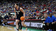 Mar 23, 2025; Raleigh, NC, USA; Connecticut Huskies forward Alex Karaban (11) drives to the basket during the first half against the Florida Gators in the second round of the NCAA Tournament at Lenovo Center. Mandatory Credit: Bob Donnan-Imagn Images
