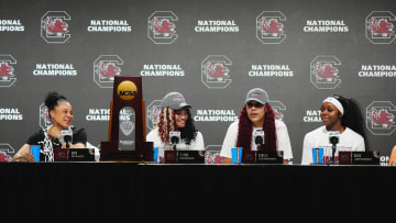 South Carolina basketball coach Dawn Staley with guards Raven Johnson and Te-Hina Paopao and center Kamilla Cardoso