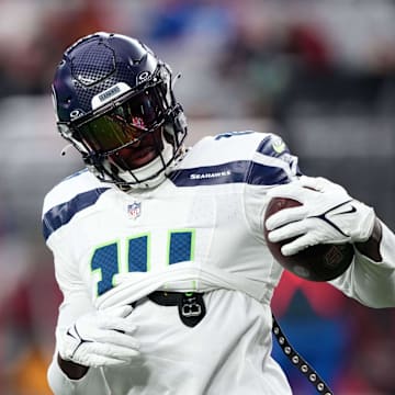 Jan 7, 2024; Glendale, Arizona, USA; Seattle Seahawks wide receiver DK Metcalf (14) warms up prior to facing the Arizona Cardinals at State Farm Stadium. Mandatory Credit: Joe Camporeale-Imagn Images