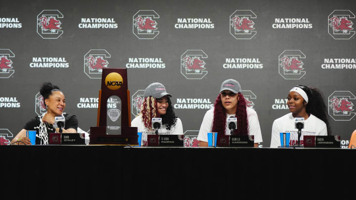 South Carolina basketball coach Dawn Staley with guards Raven Johnson and Te-Hina Paopao and center Kamilla Cardoso