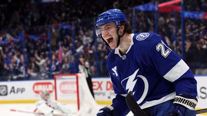 Jan 7, 2025; Tampa, Florida, USA;Tampa Bay Lightning center Brayden Point (21) celebrates after he scored the game winning goal against the Carolina Hurricanes  during the third period at Amalie Arena. Mandatory Credit: Kim Klement Neitzel-Imagn Images