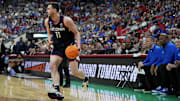Mar 23, 2025; Raleigh, NC, USA; Connecticut Huskies forward Alex Karaban (11) drives to the basket during the first half against the Florida Gators in the second round of the NCAA Tournament at Lenovo Center.